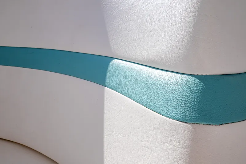 Slide: The Image of White and teal upholstery detail on 2018 Intrepid 475 Sport Yacht. - 92