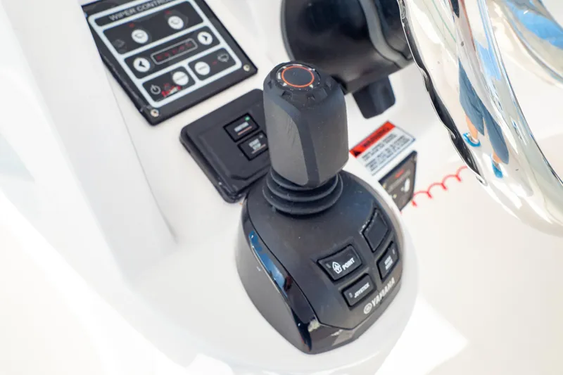 Slide: The Image of Control panel of a 2018 Intrepid 475 Sport Yacht with joystick and steering wheel. - 96