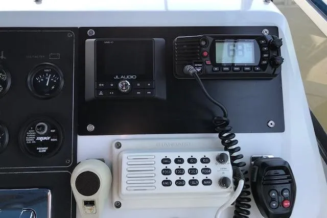 Slide: The Image of Control panel of a 1993 Carver 370 Aft Cabin Motor Yacht with radio and audio equipment. - 11