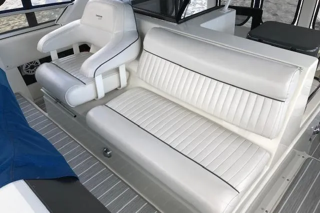 Slide: The Image of White seating on 1993 Carver 370 Aft Cabin Motor Yacht, featuring plush upholstery. - 17