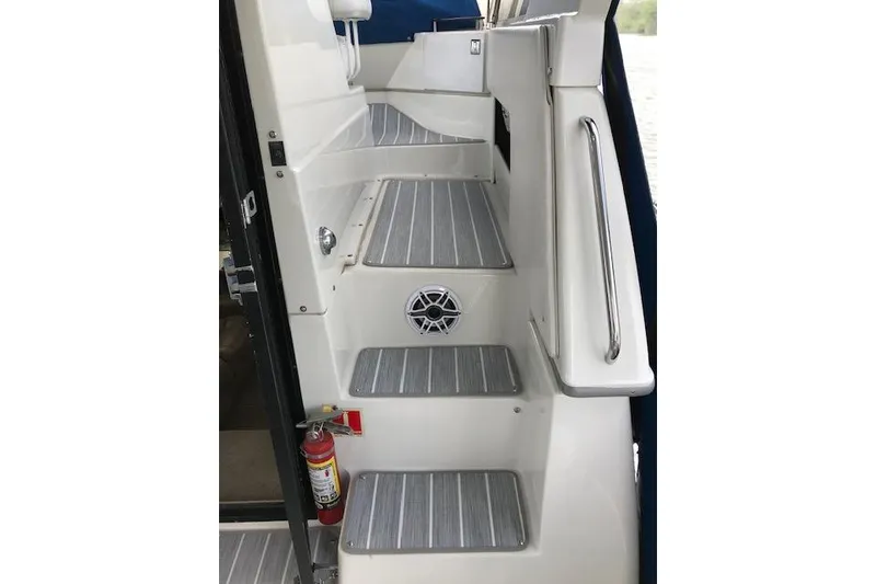 Slide: The Image of Steps on a 1993 Carver 370 Aft Cabin Motor Yacht with safety rail and fire extinguisher. - 21