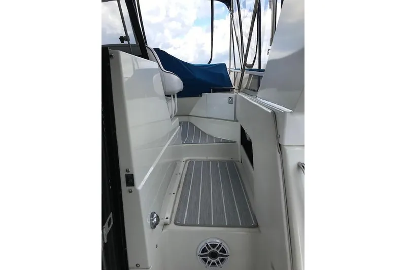 Slide: The Image of 1993 Carver 370 Aft Cabin Motor Yacht interior with sleek seating and modern design. - 23