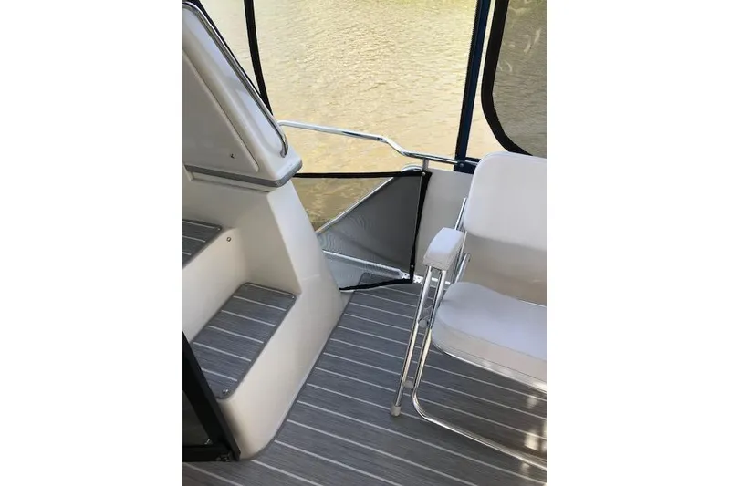 Slide: The Image of Interior view of 1993 Carver 370 Aft Cabin Motor Yacht with seating and steps. - 25