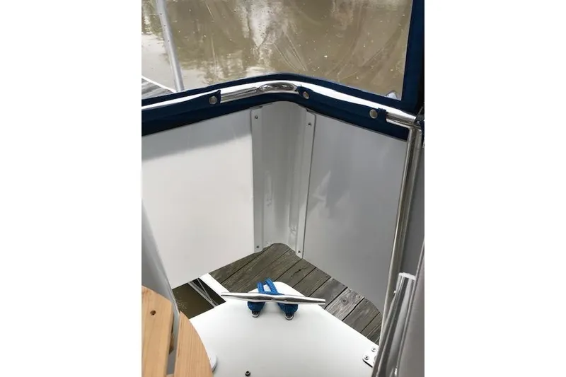 Slide: The Image of 1993 Carver 370 Aft Cabin Motor Yacht deck with railing and dock view. - 26