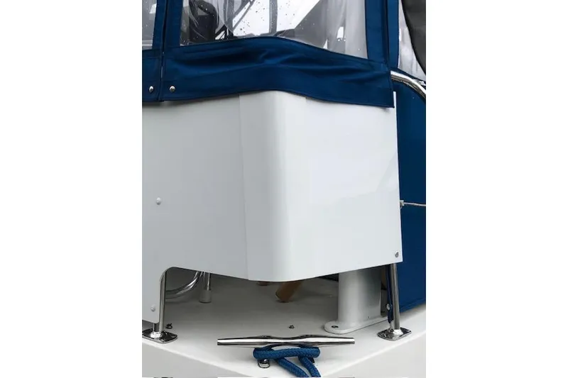 Slide: The Image of 1993 Carver 370 Aft Cabin Motor Yacht with blue canvas cover and deck details. - 27