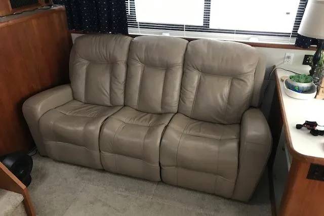 Slide: The Image of Beige leather sofa inside 1993 Carver 370 Aft Cabin Motor Yacht. - 29