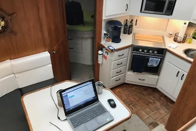 Slide: The Image of Interior of 1993 Carver 370 Aft Cabin Motor Yacht with kitchen and dining area. - 30