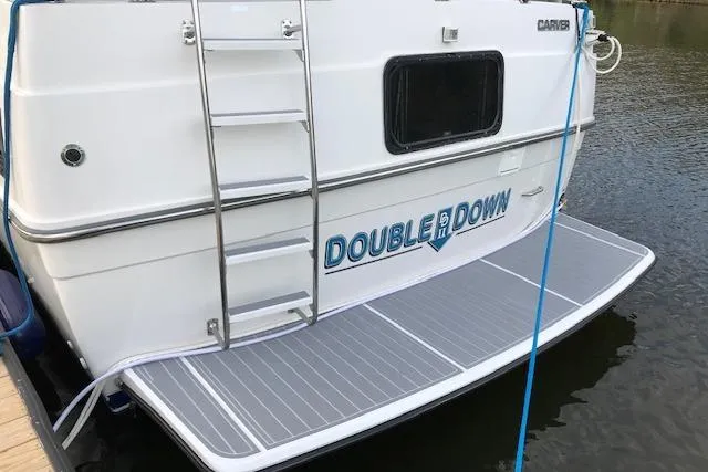 Slide: The Image of 1993 Carver 370 Aft Cabin Motor Yacht docked, featuring "Double Down" name on stern. - 8