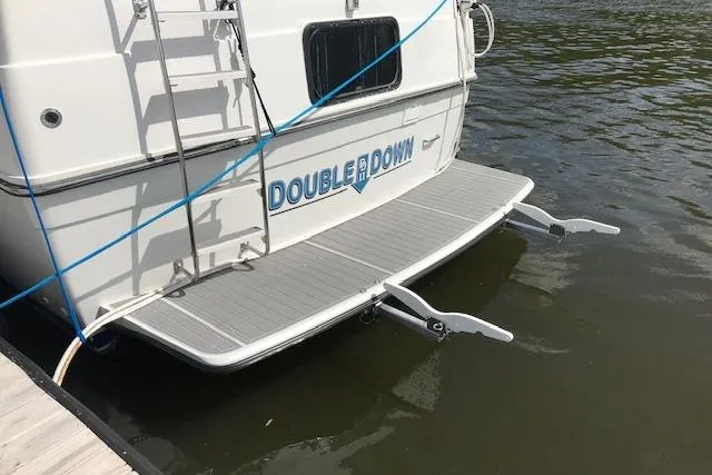 Slide: The Image of 1993 Carver 370 Aft Cabin Motor Yacht docked, featuring "Double Down" name on stern. - 9