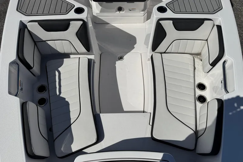 Slide: The Image of 2025 Yamaha Boats 222 FSH Sport interior with sleek white and black seating design. - 11
