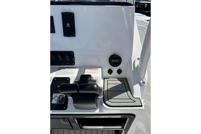 Slide: The Image of Control panel of 2025 Yamaha Boats 222 FSH Sport, featuring modern throttle and gauges. - 17