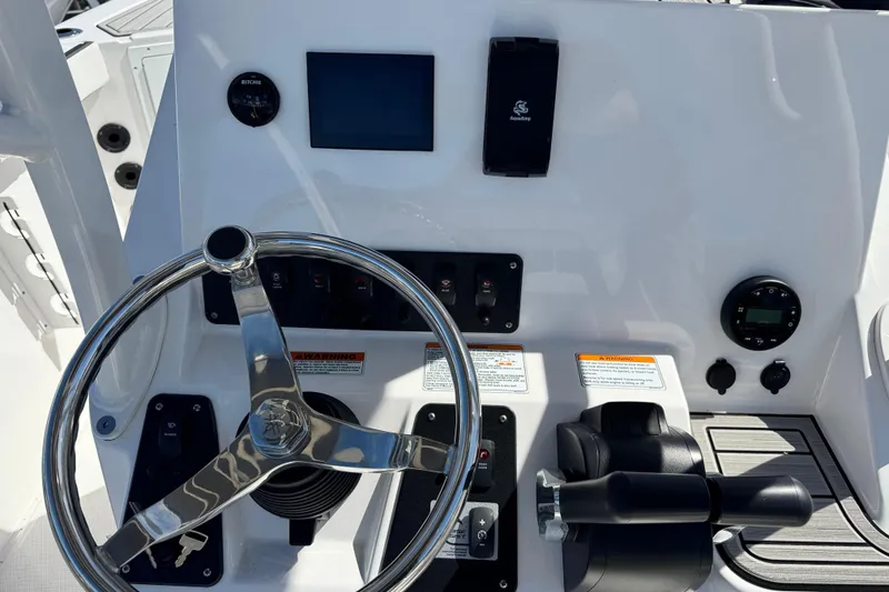 Slide: The Image of Steering console of 2025 Yamaha Boats 222 FSH Sport, featuring modern controls and instruments. - 18