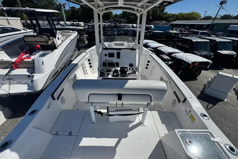 Slide: The Image of 2025 Yamaha Boats 222 FSH Sport interior view, showcasing helm and seating area. - 3