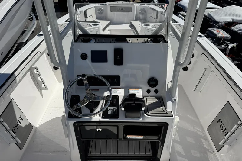 Slide: The Image of 2025 Yamaha Boats 222 FSH Sport dashboard with steering wheel and controls. - 4