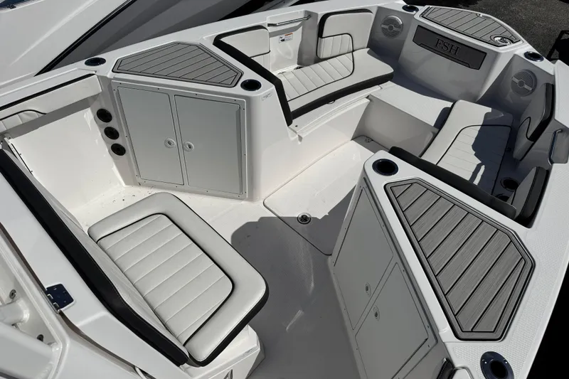 Slide: The Image of 2025 Yamaha Boats 222 FSH Sport interior with cushioned seating and storage compartments. - 5