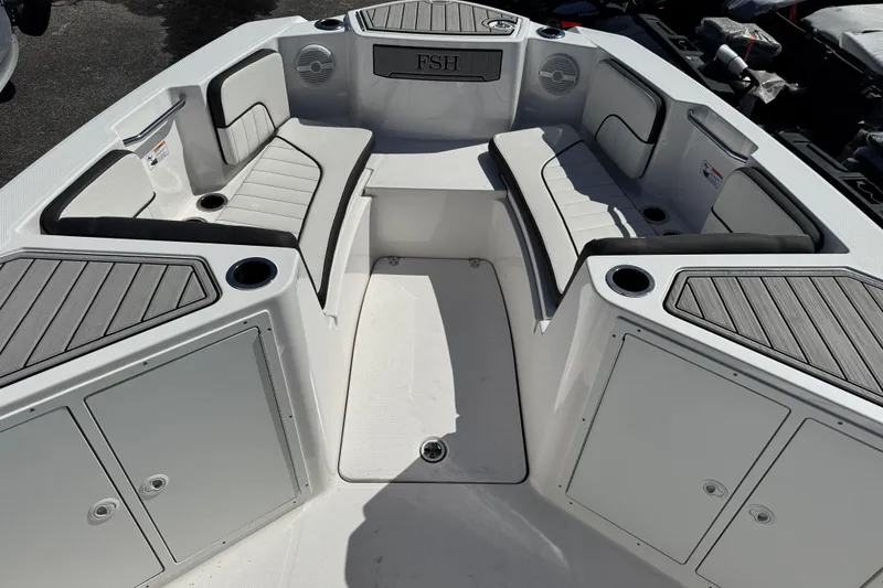 Slide: The Image of 2025 Yamaha Boats 222 FSH Sport interior with seating and storage compartments. - 7