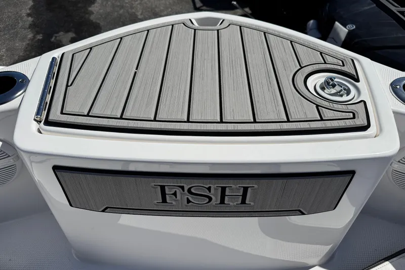 Slide: The Image of 2025 Yamaha Boats 222 FSH Sport deck with sleek design and FSH branding. - 9