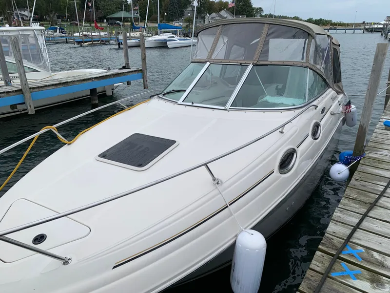 Slide: The Image of 2003 Sea Ray Sundancer docked, sleek design. - 5