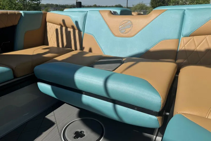 Slide: The Image of 2022 Tigé Z3 boat interior with tan and teal upholstery, featuring a stylish design. - 12
