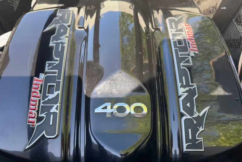 Slide: The Image of 2022 Tigé Z3 Raptor 400 engine cover with Indmar branding. - 13