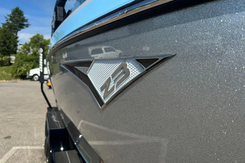 Slide: The Image of 2022 Tigé Z3 boat close-up with logo, parked outdoors. - 14