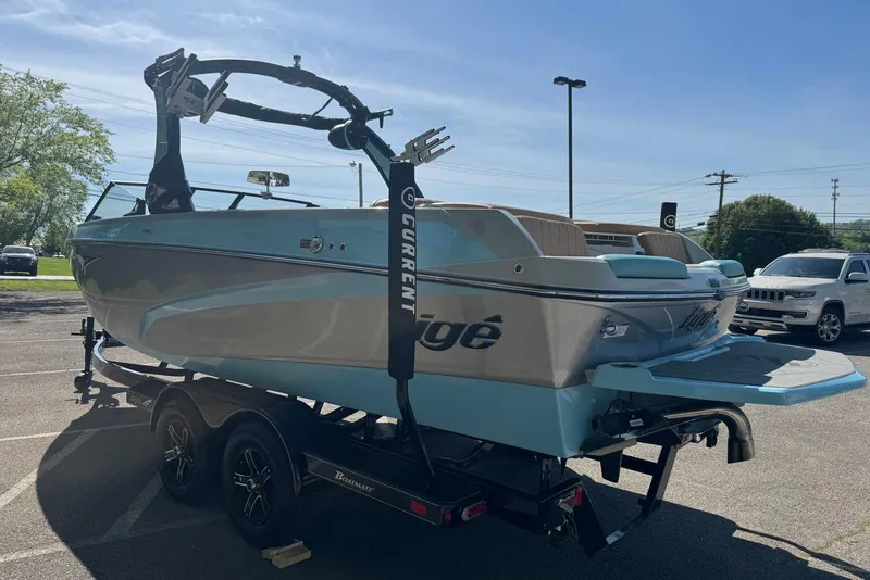 Slide: The Image of 2022 Tigé Z3 boat on trailer in parking lot, sunny day. - 4