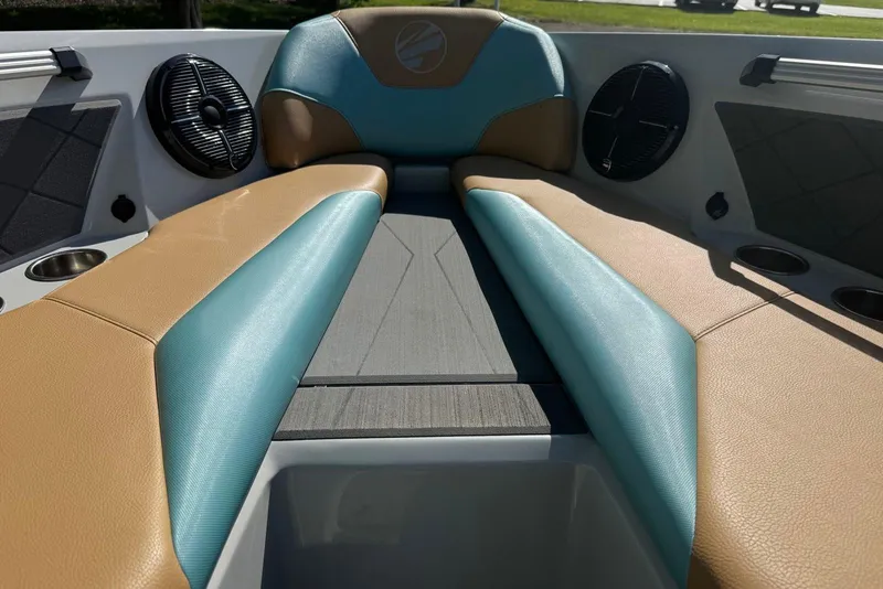 Slide: The Image of Interior of 2022 Tigé Z3 boat with tan and teal seating, featuring speakers and cup holders. - 7