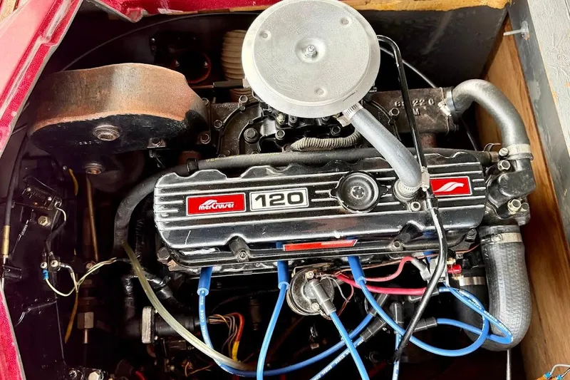 Slide: The Image of 1981 Glastron/Carlson C512 boat engine, featuring a MerCruiser 120 horsepower motor. - 24