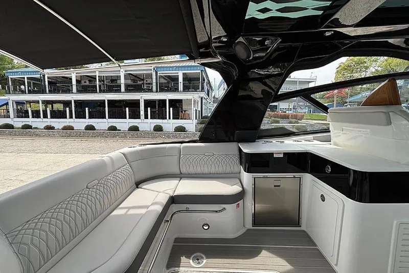 Slide: The Image of Interior of 2026 Sea Ray Sundancer 370 Outboard, featuring luxurious seating and modern amenities. - 11