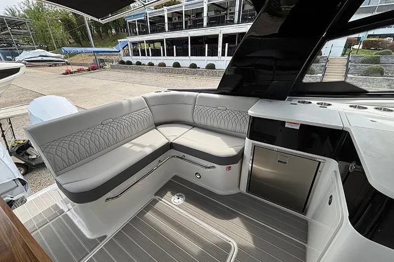Slide: The Image of Luxurious seating area on the 2026 Sea Ray Sundancer 370 Outboard yacht. - 12