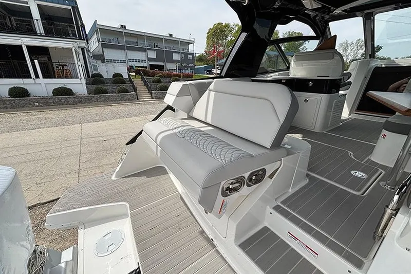 Slide: The Image of 2026 Sea Ray Sundancer 370 Outboard interior with sleek seating and modern design. - 13