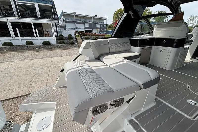 Slide: The Image of 2026 Sea Ray Sundancer 370 Outboard interior with sleek seating and modern design. - 14