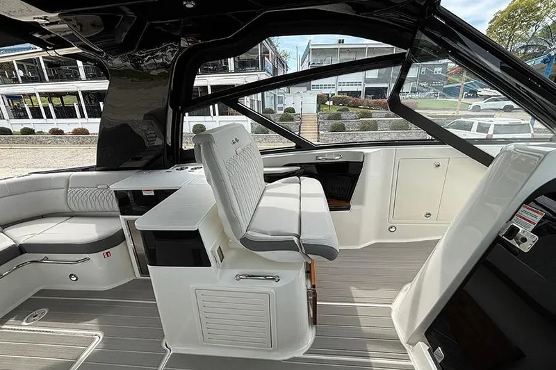 Slide: The Image of Interior of 2026 Sea Ray Sundancer 370 Outboard, featuring sleek seating and modern design. - 24