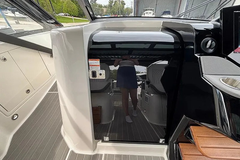 Slide: The Image of 2026 Sea Ray Sundancer 370 Outboard interior with sleek design and modern amenities. - 26