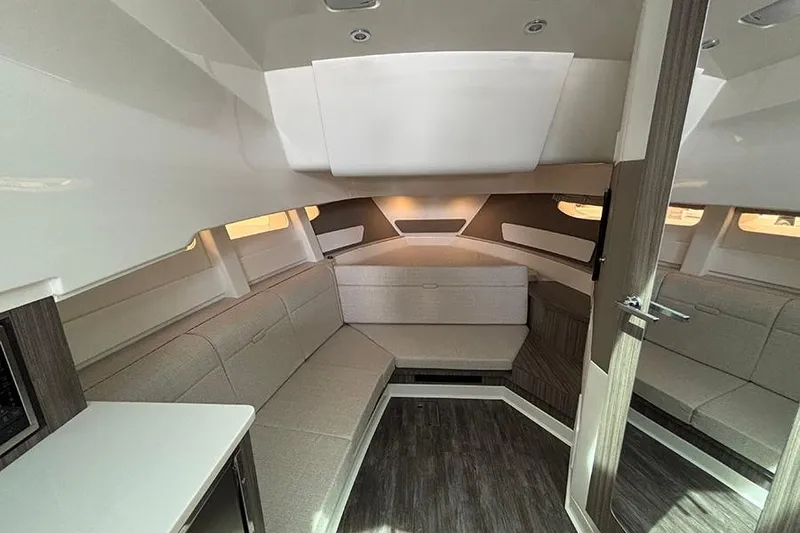 Slide: The Image of Interior of 2026 Sea Ray Sundancer 370 Outboard, featuring modern seating and sleek design. - 28