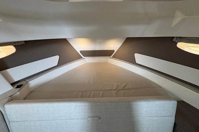 Slide: The Image of Interior cabin of 2026 Sea Ray Sundancer 370 Outboard, featuring a cozy sleeping area. - 29