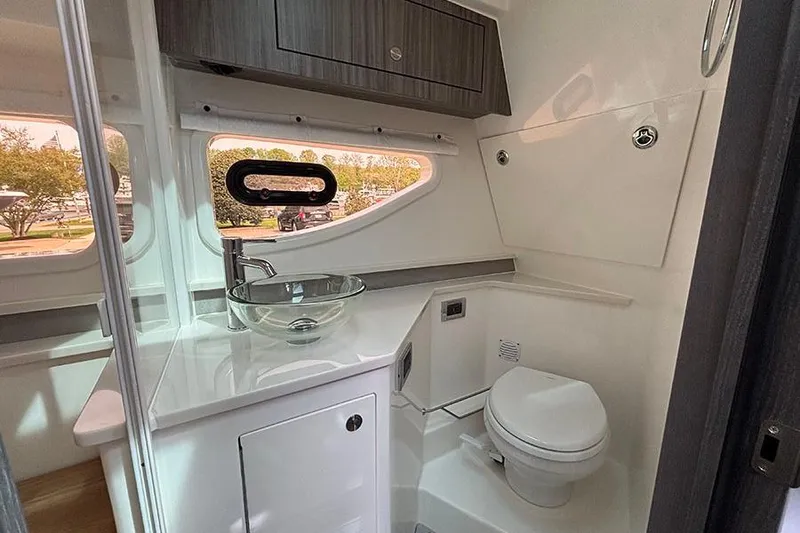 Slide: The Image of Interior of 2026 Sea Ray Sundancer 370 Outboard, featuring modern bathroom amenities. - 36