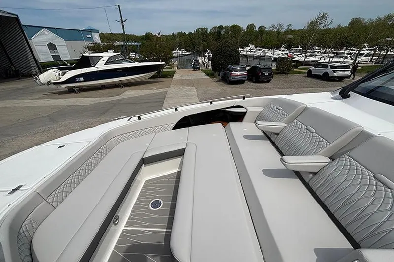 Slide: The Image of 2026 Sea Ray Sundancer 370 Outboard with luxurious seating, docked at a marina. - 40
