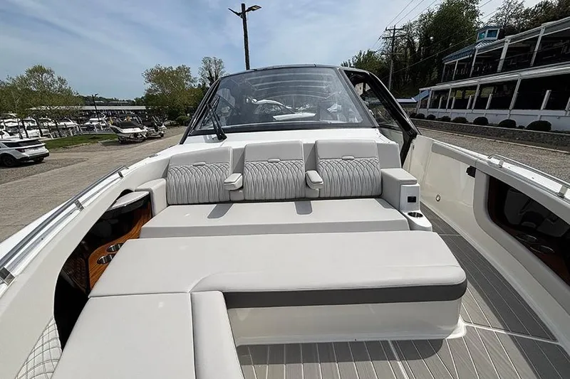 Slide: The Image of 2026 Sea Ray Sundancer 370 Outboard boat interior with plush seating and sleek design. - 42