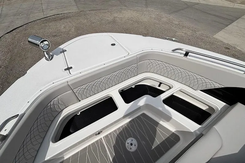 Slide: The Image of 2026 Sea Ray Sundancer 370 Outboard bow seating area with storage compartments and sleek design. - 43