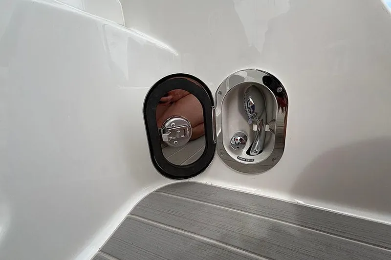 Slide: The Image of 2026 Sea Ray Sundancer 370 Outboard water inlet and fuel cap detail. - 6