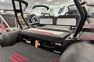 Slide: The Image of 2025 Highfield Velox 420 boat interior with seating and modern design in showroom. - 4