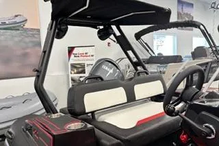 Slide: The Image of 2025 Highfield Velox 420 boat interior with modern seating and steering wheel. - 5