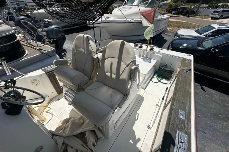 Slide: The Image of 1998 True World Marine TE286 boat interior with dual seats and steering wheel. - 13