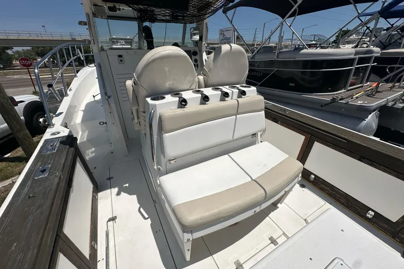 Slide: The Image of 1998 True World Marine TE286 boat interior with seating and control panel. - 16