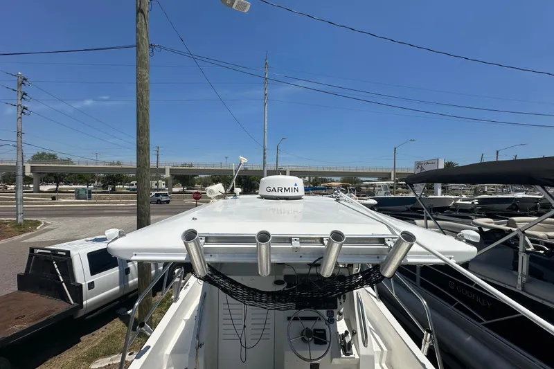 Slide: The Image of 1998 True World Marine TE286 boat with Garmin equipment, docked under clear blue sky. - 18