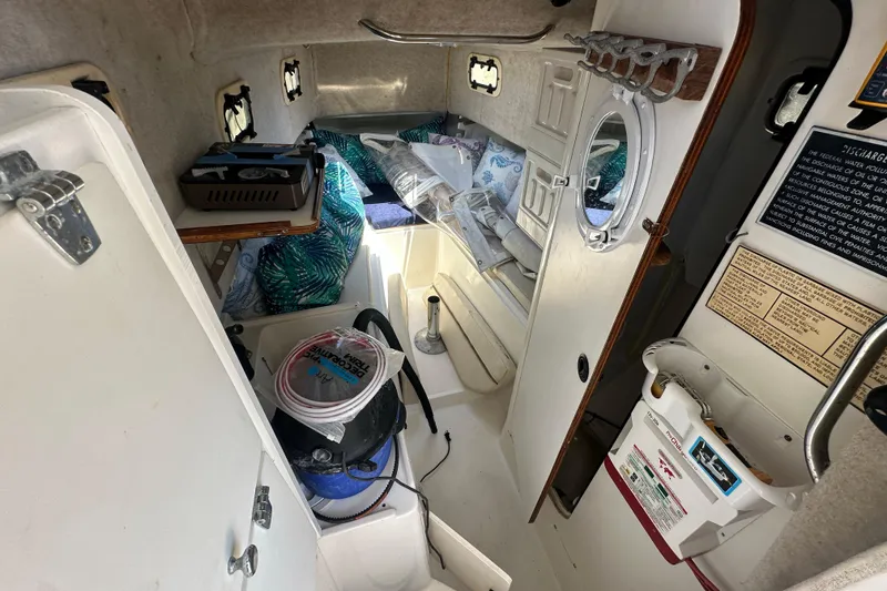 Slide: The Image of Interior of 1998 True World Marine TE286 boat cabin with storage and equipment. - 20