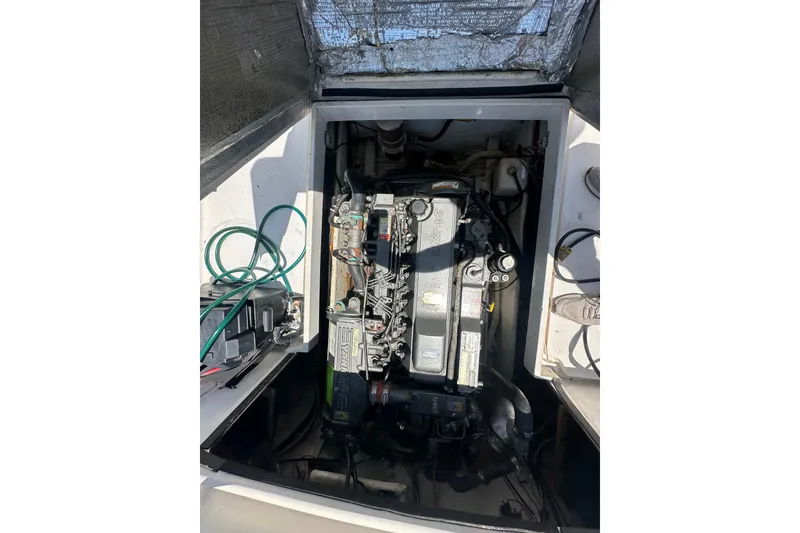 Slide: The Image of Engine compartment of a 1998 True World Marine TE286 boat, showing detailed machinery. - 7