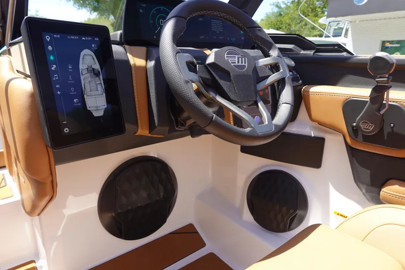 Slide: The Image of 2026 Malibu Wakesetter 21 LX dashboard with touchscreen and steering wheel. - 13