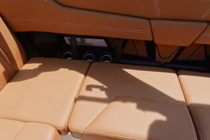 Slide: The Image of 2026 Malibu Wakesetter 21 LX interior with tan leather seating and sleek design. - 17